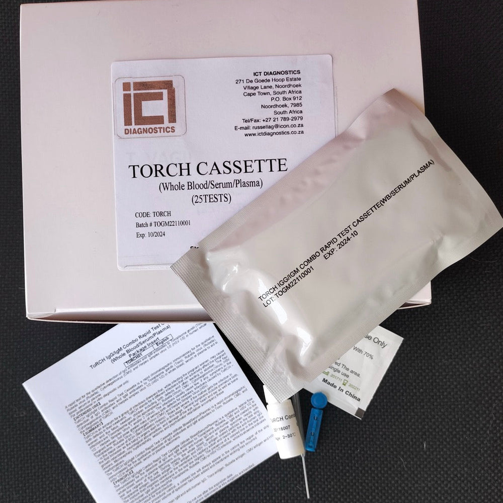 A medical test kit labeled 'TORCH CASSETTE (Wide BloodSerum/Plasma) (2TESTS)' with its box, a sealed specimen pouch, printed paperwork, and a blue-and-silver syringe on a dark textured background.