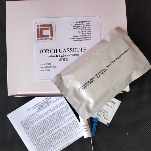 A medical test kit labeled 'TORCH CASSETTE (Wide BloodSerum/Plasma) (2TESTS)' with its box, a sealed specimen pouch, printed paperwork, and a blue-and-silver syringe on a dark textured background.